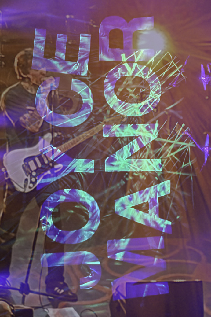 Overlaped concert photos - Joyce Manor banner in Goosebimps spider wens and an imahe of the lead singer