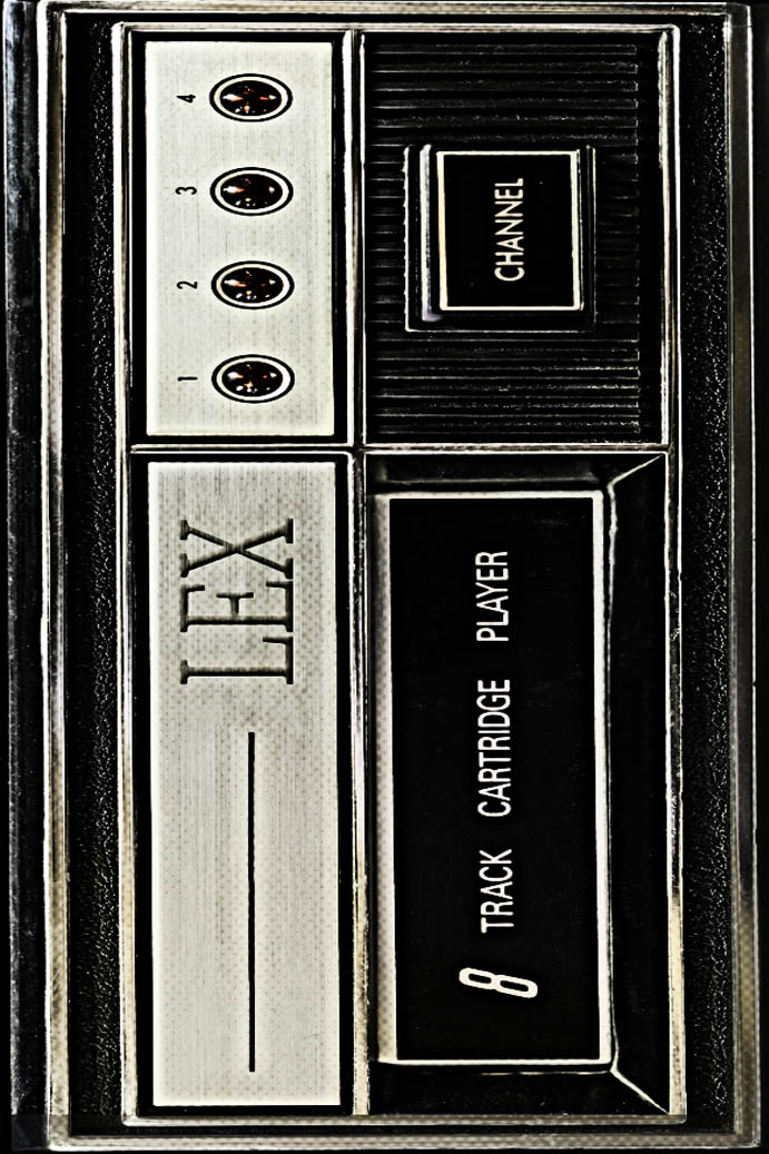 Stock photo of an 8 track with some texture on it - it says "LEX"